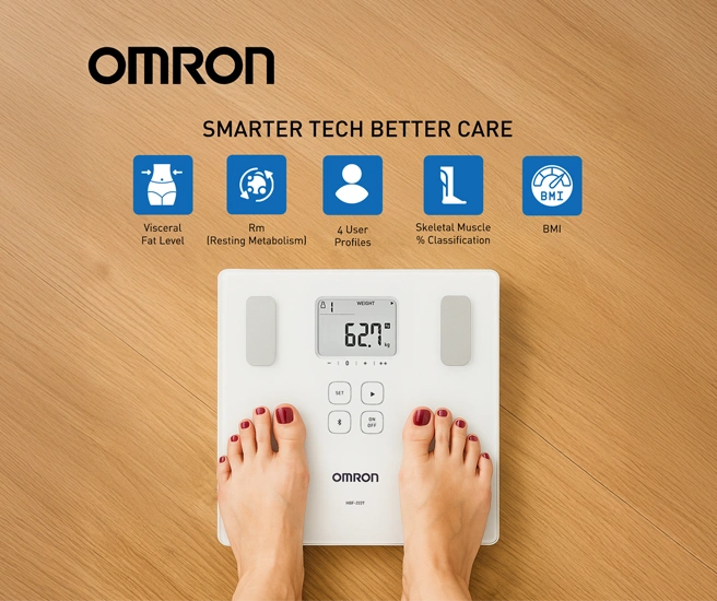 Omron body composition scale on a wooden floor with feet on it, displaying health metrics.