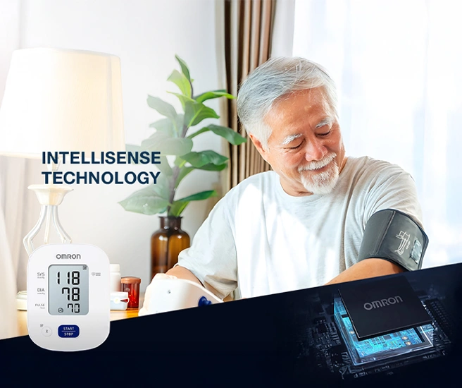 Man using an Omron blood pressure monitor with 'Intellisense Technology' text.