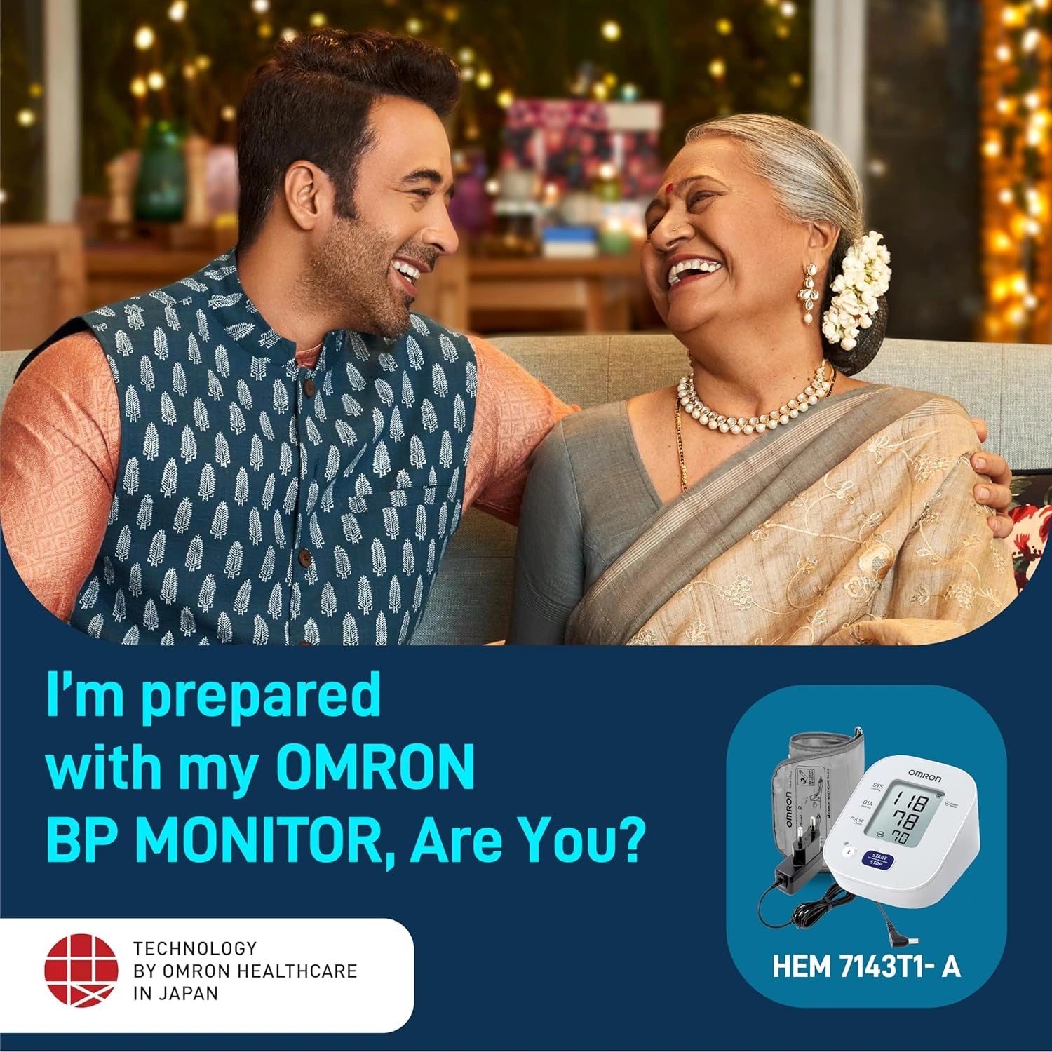 Man and woman sitting together with an OMRON blood pressure monitor displayed.