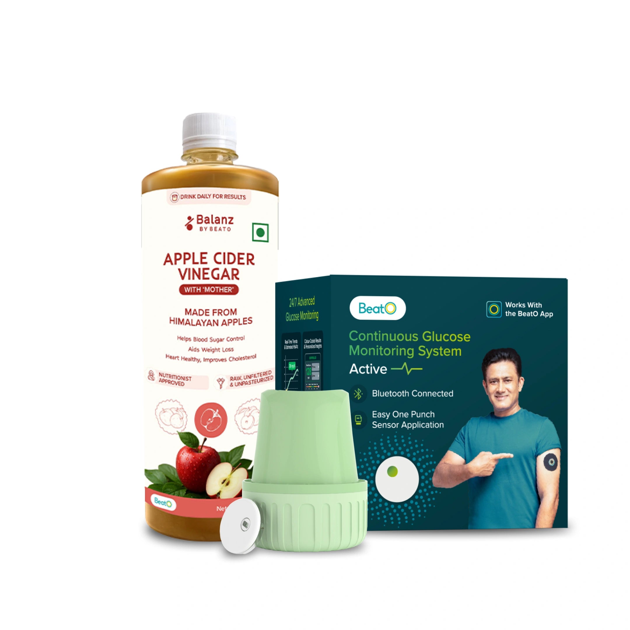 Apple Cider Vinegar bottle, container of apples, and Continuous Glucose Monitoring System packaging on a white background